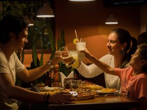 An image of people toasting at a table